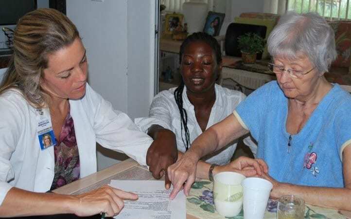 Doctor and caregiver going over results with patient