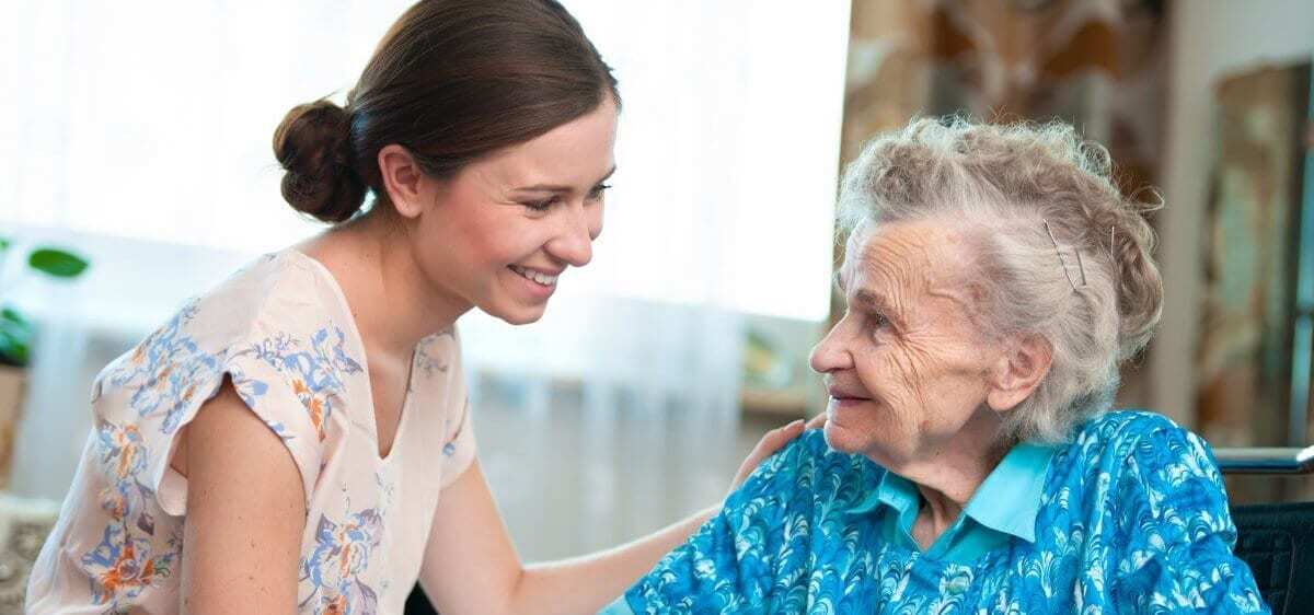 A woman taking care of an older person