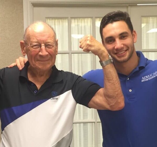 Two men flexing their muscles