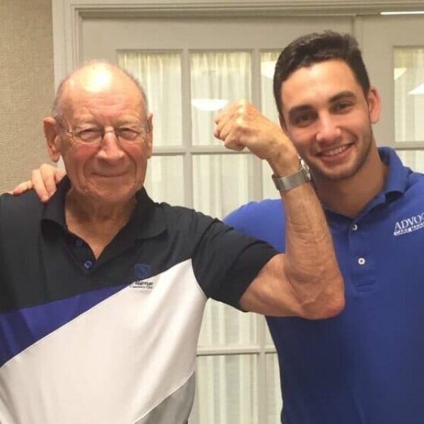 Two men flexing their muscles