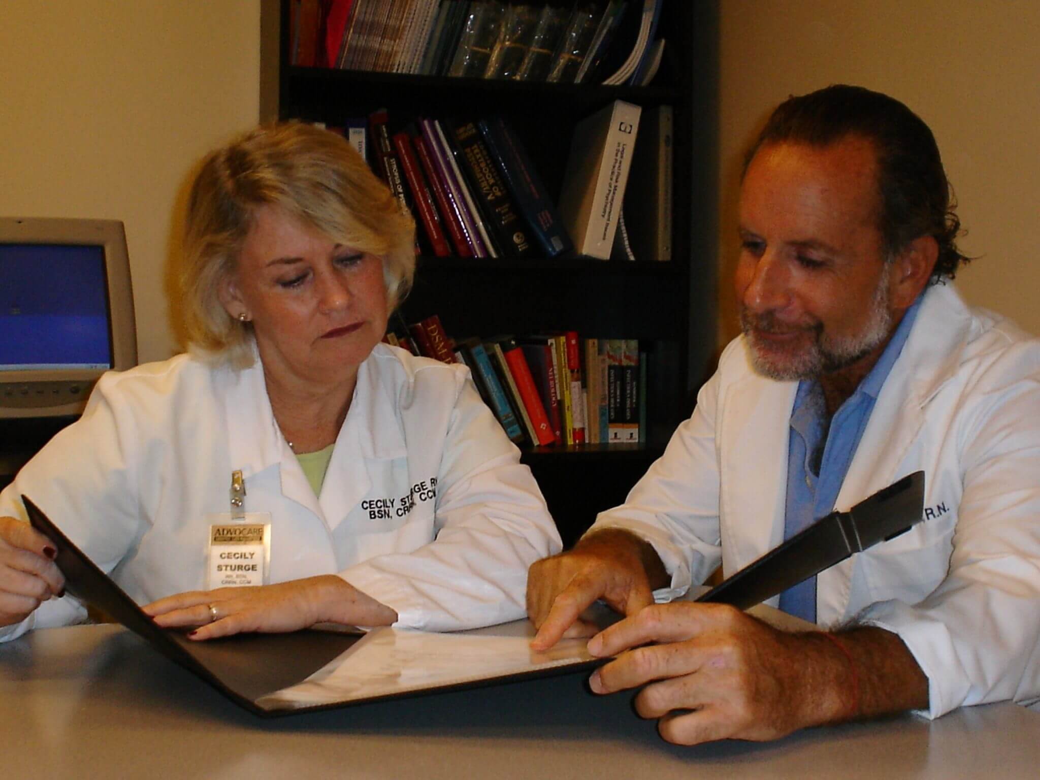 Doctors looking over paperwork