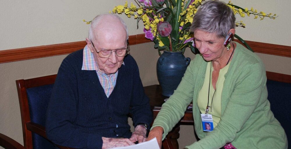 Caregiver reading a document for patient