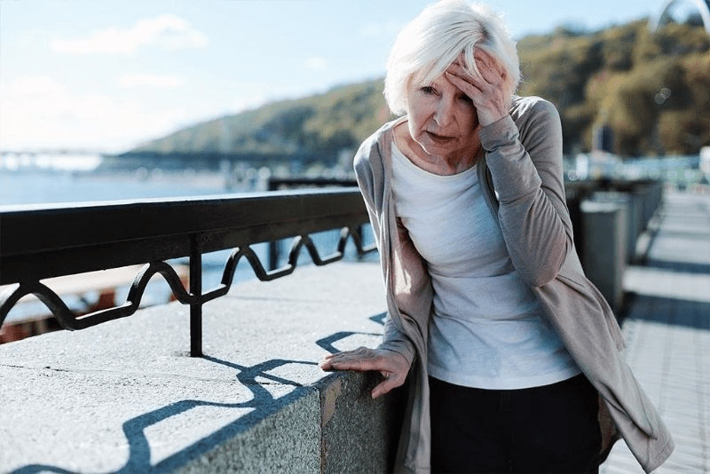 Older woman having a headache